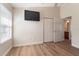 A bedroom featuring a television hung on the wall, a double door closet, and lots of natural light at 12054 Ne 51St Cir, Oxford, FL 34484