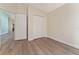 Neutral bedroom featuring a double door closet, and an entry way into another room at 12054 Ne 51St Cir, Oxford, FL 34484