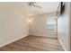 Neutral bedroom with vaulted ceiling, ceiling fan, and light colored flooring at 12054 Ne 51St Cir, Oxford, FL 34484
