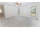 Bright and airy bedroom offering natural light through large windows at 12196 Ne 4Th Pl, Oxford, FL 34484