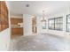 Dining room area with natural light through dark-trimmed windows, adjoining the kitchen at 12196 Ne 4Th Pl, Oxford, FL 34484