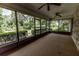 A large screened porch offers views of the surrounding greenery and a tranquil outdoor space at 12196 Ne 4Th Pl, Oxford, FL 34484