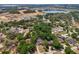 Aerial view featuring the property location with lake and new construction nearby at 1254 Magnolia Farms Ct, Eustis, FL 32726