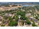 Aerial view featuring the property location with lake and new construction nearby at 1254 Magnolia Farms Ct, Eustis, FL 32726