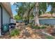 Backyard view with lush trees and storage shed at 1254 Magnolia Farms Ct, Eustis, FL 32726
