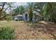 Inviting single-story home with a well-manicured lawn and a mature palm tree in the front yard at 1254 Magnolia Farms Ct, Eustis, FL 32726