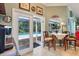 Charming kitchen with dining area, seamlessly flowing to a pool view, perfect for casual meals with a serene backdrop at 1254 Magnolia Farms Ct, Eustis, FL 32726