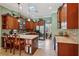 Modern kitchen with stainless steel appliances, custom cabinets, and a center island with seating at 1254 Magnolia Farms Ct, Eustis, FL 32726