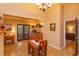 Dining room features hardwood floors and French doors to backyard at 12846 Brown Bark Trl, Clermont, FL 34711