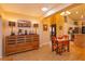 Dining room features skylight and hardwood floors at 12846 Brown Bark Trl, Clermont, FL 34711
