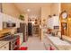 Galley kitchen features granite countertops, stainless steel appliances, and breakfast bar at 12846 Brown Bark Trl, Clermont, FL 34711