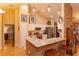 Bright eat-in kitchen features granite countertops, stainless steel appliances, and a stone-accented breakfast bar at 12846 Brown Bark Trl, Clermont, FL 34711