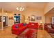 Inviting living room with modern furniture, bright wood floors, and large windows at 12846 Brown Bark Trl, Clermont, FL 34711