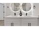 Dual vanity bathroom with modern faucets, white countertops, and decorative flower vase at 13524 Sw 89 St, Dunnellon, FL 34432