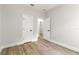 Bedroom with a spacious closet area featuring a door to an additional bedroom at 13524 Sw 89 St, Dunnellon, FL 34432