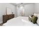 Comfortable bedroom with stylish decor, wood dresser, and modern finishes at 13524 Sw 89 St, Dunnellon, FL 34432