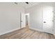 Bedroom with a spacious closet area featuring a door to an additional bedroom at 13524 Sw 89 St, Dunnellon, FL 34432
