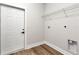 A simple and functional laundry room area with ample shelving and connections ready for appliances at 13524 Sw 89 St, Dunnellon, FL 34432