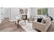 Stylish living room with modern furniture, wood-look floors, and neutral decor at 13524 Sw 89 St, Dunnellon, FL 34432
