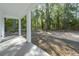 Covered patio with serene view of wooded backyard at 13524 Sw 89 St, Dunnellon, FL 34432