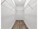 Spacious walk-in closet with wire shelving and wood-look flooring at 13524 Sw 89 St, Dunnellon, FL 34432