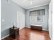 Comfortable bedroom with hardwood floors, closet, and natural light from the window at 14235 Se 85Th Ave, Summerfield, FL 34491