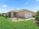 Charming single story home with an attached garage, well-maintained lawn, and minimalist rock garden landscaping at 14235 Se 85Th Ave, Summerfield, FL 34491