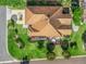An aerial view of the home shows well-maintained landscaping and a screened-in porch perfect for enjoying the outdoors at 1501 Lavaca Ln, The Villages, FL 32159