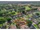 Bird's eye view of a lovely home with a manicured lawn, beautiful landscaping, and a peaceful neighborhood setting at 1501 Lavaca Ln, The Villages, FL 32159