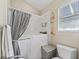 Clean bathroom featuring a walk-in tub with an accessible shower and ample lighting at 1501 Lavaca Ln, The Villages, FL 32159