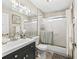 Clean bathroom with sleek vanity, modern fixtures and a shower-tub combo at 1501 Lavaca Ln, The Villages, FL 32159