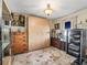 Cozy bedroom features a large wardrobe and beautiful decor at 1501 Lavaca Ln, The Villages, FL 32159