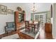 Beautiful dining room featuring hardwood floors, stylish furnishings, and a sliding glass door at 1501 Lavaca Ln, The Villages, FL 32159