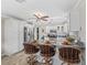 Open kitchen design with granite island, breakfast bar, and stainless steel appliances for modern living at 1501 Lavaca Ln, The Villages, FL 32159