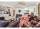Open-concept living room with hardwood floors and a seamless flow to other living spaces at 1501 Lavaca Ln, The Villages, FL 32159