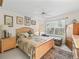Relaxing main bedroom with natural light, soft colors and a ceiling fan at 1501 Lavaca Ln, The Villages, FL 32159