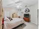 Main bedroom with ample closet space, neutral tones and standard ceiling fan at 1501 Lavaca Ln, The Villages, FL 32159