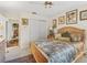 Comfortable main bedroom with natural light, ceiling fan, and ensuite access at 1501 Lavaca Ln, The Villages, FL 32159