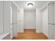 Walk in closet featuring wood floors and built-in shelving at 1502 Blueberry Way, The Villages, FL 32162