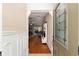 Inviting foyer showcasing hardwood floors, a view into the living space, and decorative trim at 1502 Blueberry Way, The Villages, FL 32162