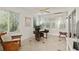 Bright office space with many windows providing lots of natural light and tile floors at 1502 Blueberry Way, The Villages, FL 32162