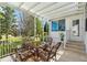Relaxing covered patio with dining set and views of the landscaped backyard at 1502 Blueberry Way, The Villages, FL 32162
