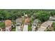 Aerial view of the houses, driveways, and landscaping in the neighborhood at 1512 S Pointe Dr, Leesburg, FL 34748