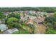 Scenic aerial view showcasing the neighborhood's layout, landscaping, and surroundings at 1512 S Pointe Dr, Leesburg, FL 34748