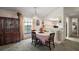 Bright dining area with large window and pass-through to the kitchen at 1512 S Pointe Dr, Leesburg, FL 34748