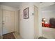 Bright foyer with neutral tile flooring and convenient closet space at 1512 S Pointe Dr, Leesburg, FL 34748