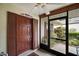Inviting front door and sidelight with views of the front porch at 1512 S Pointe Dr, Leesburg, FL 34748
