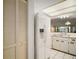 Bright kitchen with white appliances, ample cabinetry, and a tile floor at 1512 S Pointe Dr, Leesburg, FL 34748