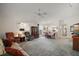 Spacious living room featuring comfortable seating and plenty of natural light at 1512 S Pointe Dr, Leesburg, FL 34748