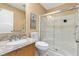 Clean bathroom with a glass-enclosed shower, updated vanity, and tile flooring at 1513 Lozano Ave, The Villages, FL 32159